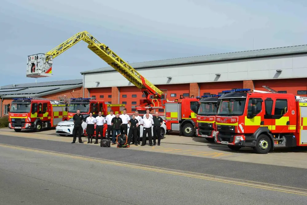 New fire engines and the team behind their procurement lined up outside Ipswich East fire station.