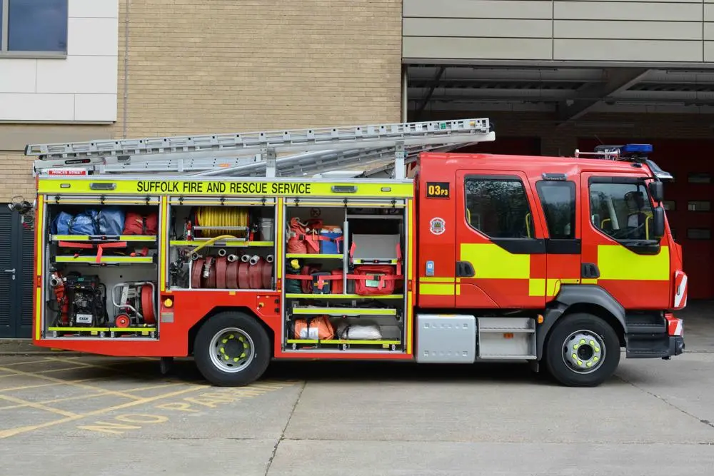 Type B fire engine displaying its stored equipment.