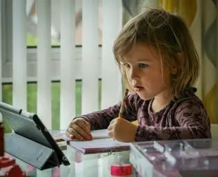 Child learning on a tablet