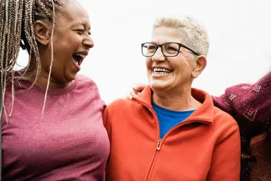 Older women laughing together