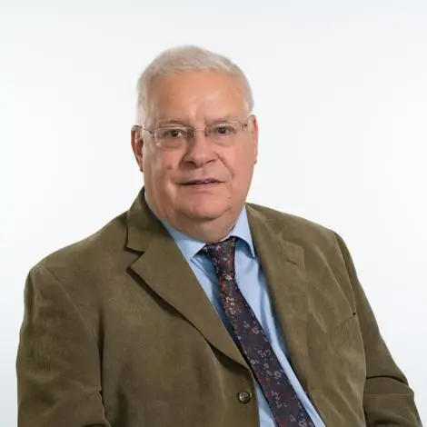 Councillor Chris Cox wearing brown jacket, shirt and tie