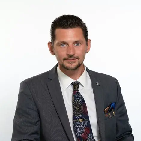 Cllr Chris Smith wearing suit and tie