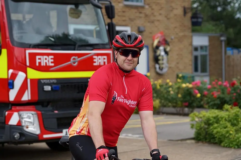 Firefighter Simon Lewis gets on his bike for the Fire Ride