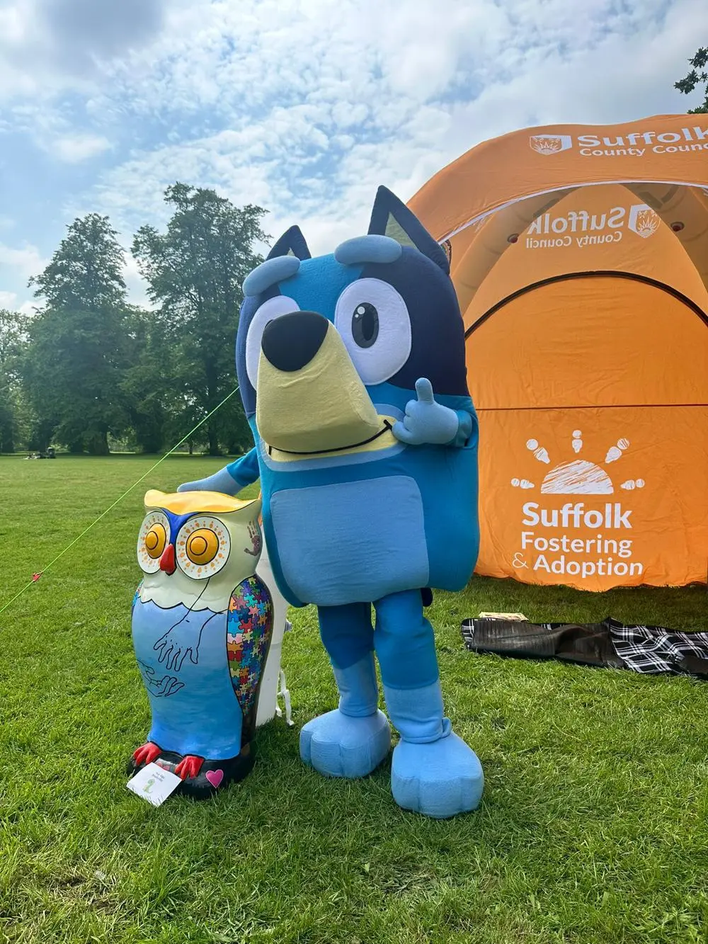 CBeebies character Bluey, with Suffolk Fostering and Adoption tent and Owl