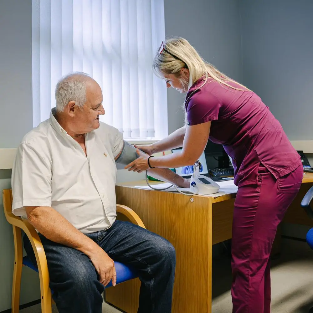 Cllr Wiles having his blood pressure taken