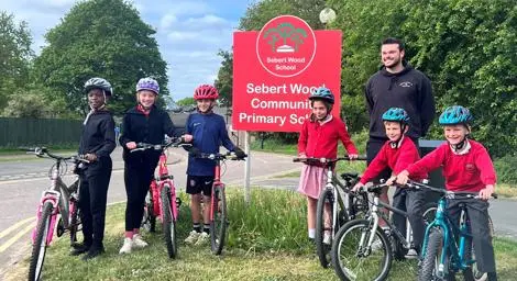 A group of school children on bicycles