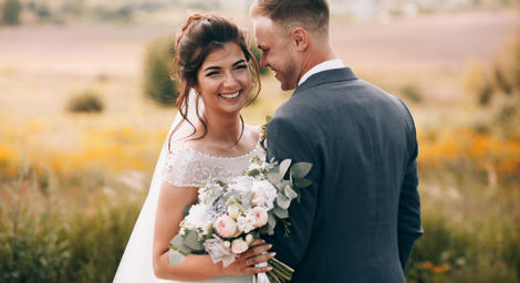 Married couple in a field.