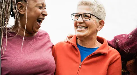 Older women laughing together