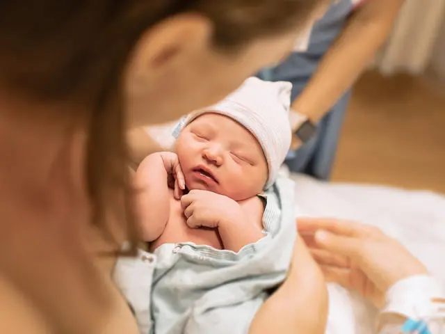 Mother holding newborn baby